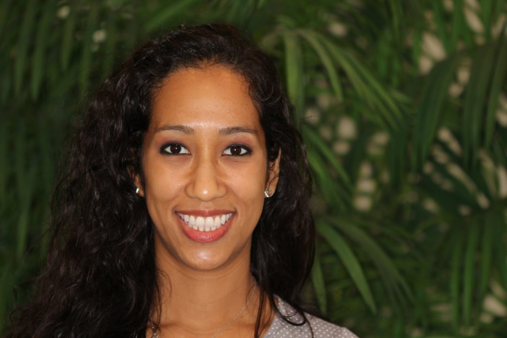 Woman smiling after neuromuscular braces