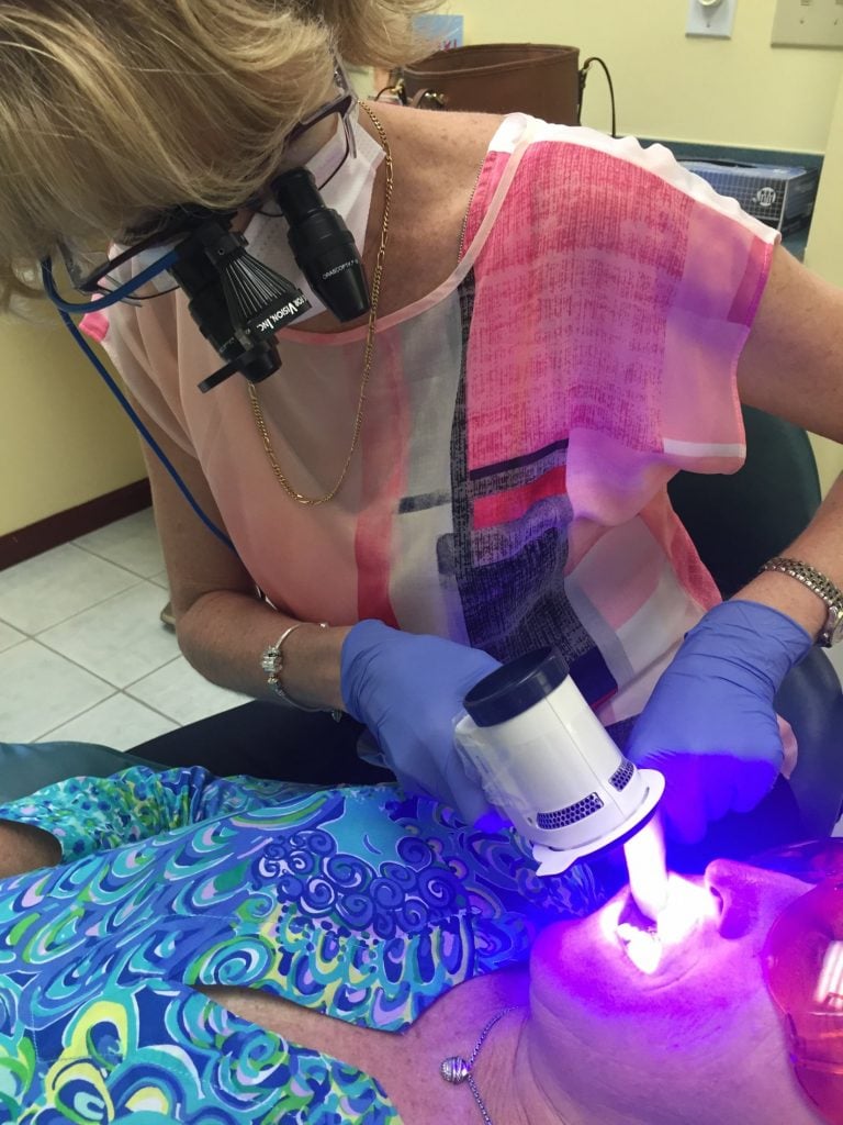 Dr. Lopez-Belio working on a patient for Oral Cancer & Dental Implants 